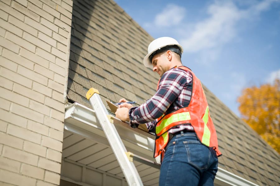 Roof inspector performing his job
